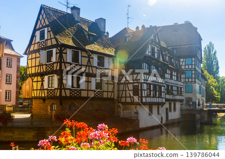 Summer day in Strasbourg, view of houses along canal Summer day in Strasbourg, view of houses along canal 139786044