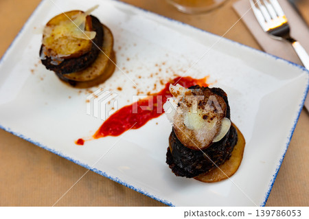 Timbale of pear and cheese blood sausage. Traditional dish for the region of Salamanca and Zaragoza Timbale of pear and cheese blood sausage. Traditional dish for the region of Salamanca and Zaragoza 139786053