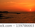 The sunset over Nagawase Fishing Port, staining the sky like flames as it descends. 139786663