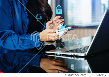 Cybersecurity and privacy concepts to protect data. Lock icon and network security technology. Man protecting personal data on smartphone tablet, virtual screen interfaces. In office Cybersecurity and privacy concepts to protect data. Lock icon and network security technology. Man protecting personal data on smartphone tablet, virtual screen interfaces. In office 139786967