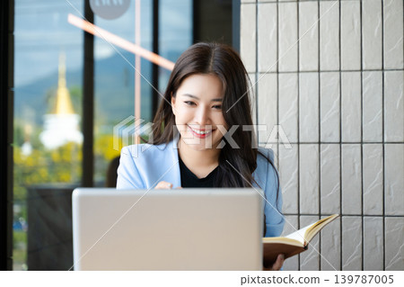 Business woman using tablet and laptop for doing math finance on an office desk, tax, report, accounting, statistics, and analytical research concept Business woman using tablet and laptop for doing math finance on an office desk, tax, report, accounting, statistics, and analytical research concept 139787005