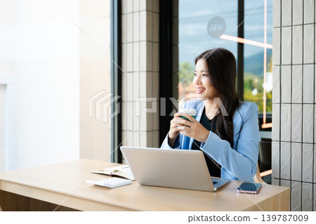 Business woman using tablet and laptop for doing math finance on an office desk, tax, report, accounting, statistics, and analytical research concept Business woman using tablet and laptop for doing math finance on an office desk, tax, report, accounting, statistics, and analytical research concept 139787009
