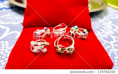 Traditional Silver Toe Rings (Bichhiya) on Red Velvet Display Traditional Silver Toe Rings (Bichhiya) on Red Velvet Display 139788200