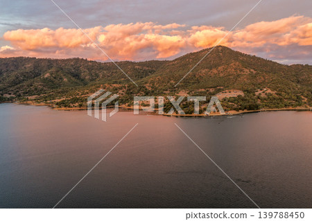 Aerial view of Glenbawn Dam, surrounding camping areas and the Liverpool Range in NSW Australia. Drone photograph captures the expansive reservoir, bushland campsites and mountain landscape from Aerial view of Glenbawn Dam, surrounding camping areas and the Liverpool Range in NSW Australia. Drone photograph captures the expansive reservoir, bushland campsites and mountain landscape from 139788450
