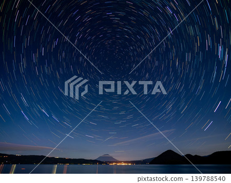 Starry sky over Lake Toya and Mount Yotei Starry sky over Lake Toya and Mount Yotei 139788540