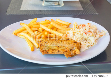 Cod with fries and salad. Cod with fries and salad. 139788606