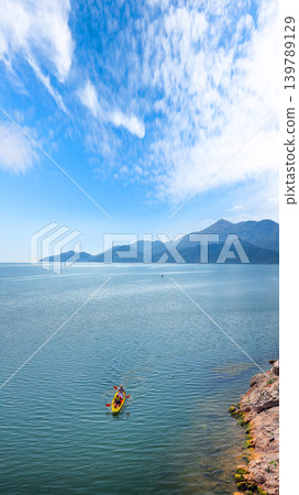 Amazing view of Skadar lake surrounded by green mountain peaks on a sunny day. 139789129