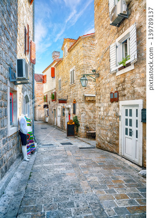 Amazing view of Old Town Citadela with paved narrow street in the Budva city. 139789137