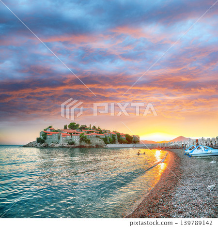 Amazing sunset view of luxury beach and islet Sveti Stefan near Budva. Amazing sunset view of luxury beach and islet Sveti Stefan near Budva. 139789142