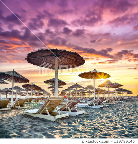 Amazing Sun umbrellas and deckchairs on the Copacabana beach, part of Great Beach (Velika Plaza) in Ulcinj. Amazing Sun umbrellas and deckchairs on the Copacabana beach, part of Great Beach (Velika Plaza) in Ulcinj. 139789146