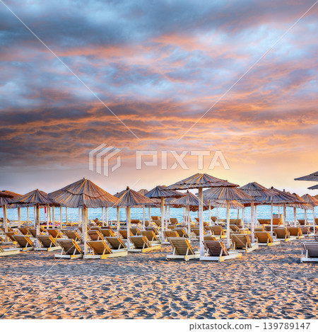 Amazing Sun umbrellas and deckchairs on the Copacabana beach, part of Great Beach (Velika Plaza) in Ulcinj. Amazing Sun umbrellas and deckchairs on the Copacabana beach, part of Great Beach (Velika Plaza) in Ulcinj. 139789147