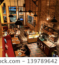 Interior view of a stylish cafe with brick walls. Interior view of a stylish cafe with brick walls. 139789642