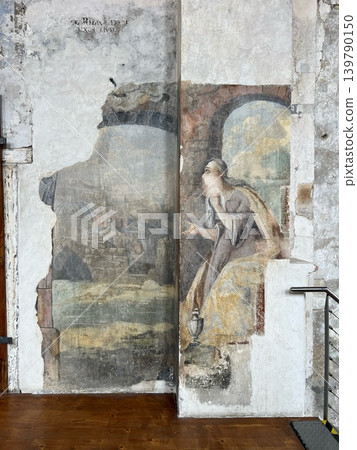Historic fresco depicting a woman in a contemplative pose alongside a scenic Historic fresco depicting a woman in a contemplative pose alongside a scenic 139790150
