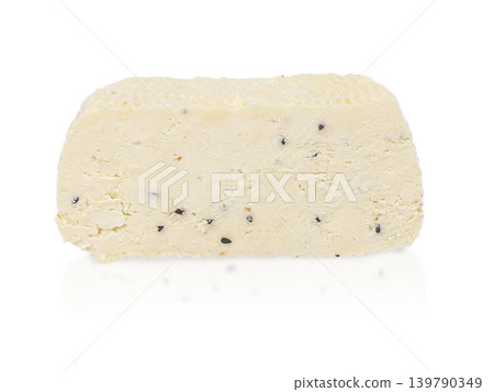 Fresh dairy cheese with black sesame isolated on white background, side view, minimalist food banner concept Fresh dairy cheese with black sesame isolated on white background, side view, minimalist food banner concept 139790349