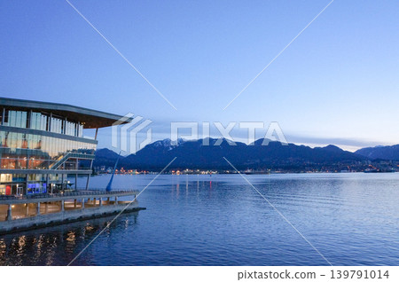 The exterior of Canada Place glows at dusk. The exterior of Canada Place glows at dusk. 139791014