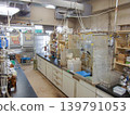A university chemistry lab lined with experimental equipment. 139791053