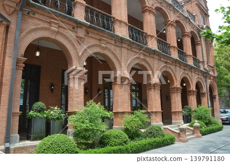 An elegant red brick arcade corridor An elegant red brick arcade corridor 139791180