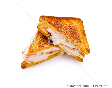 Two grilled sandwiches with turkey and cheese on a white background Two grilled sandwiches with turkey and cheese on a white background 139791338