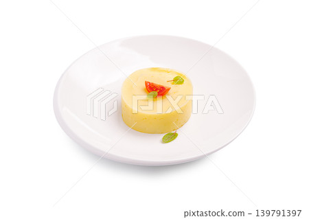 Creamy mashed potatoes served with simple garnish on white plate. Creamy mashed potatoes served with simple garnish on white plate. 139791397