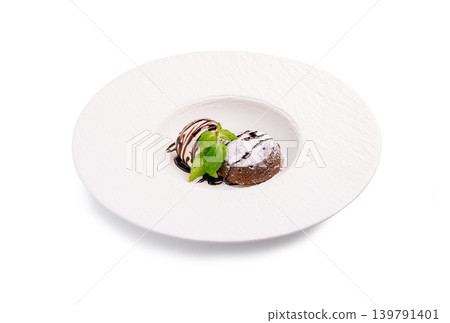 Chocolate fondant with vanilla ice cream and mint Chocolate fondant with vanilla ice cream and mint 139791401