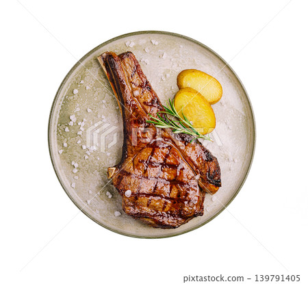 Juicy grilled meat with potatoes served on a plate for lunch or dinner 139791405