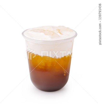 Cold drink with layered colors served in clear cup at local cafe 139791436