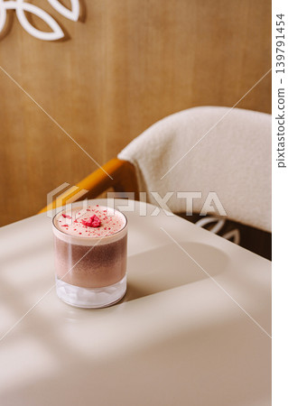Delicious drink served in a glass on a simple table at a cozy cafe 139791454