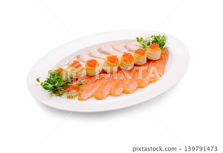 Seafood platter with salmon, fish roe, and greens on a white plate Seafood platter with salmon, fish roe, and greens on a white plate 139791473