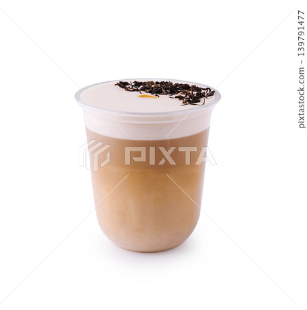 Coffee drink with layers and tea leaves on top in a plastic cup Coffee drink with layers and tea leaves on top in a plastic cup 139791477