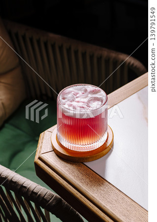 Refreshing drink on a wooden table in a cozy setting Refreshing drink on a wooden table in a cozy setting 139791549