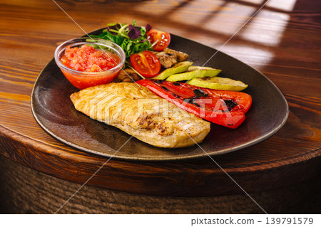 Grilled chicken with vegetables and salsa on a plate for lunch Grilled chicken with vegetables and salsa on a plate for lunch 139791579