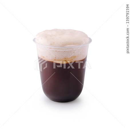 Rich coffee drink served in a clear cup with froth on top Rich coffee drink served in a clear cup with froth on top 139791594
