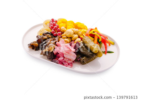 Colorful platter with assorted pickles and fruits in a simple setting 139791613