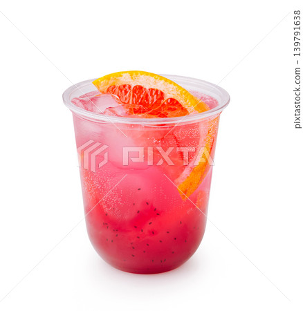 Delicious drink with ice and fruit sits in clear plastic cup 139791638