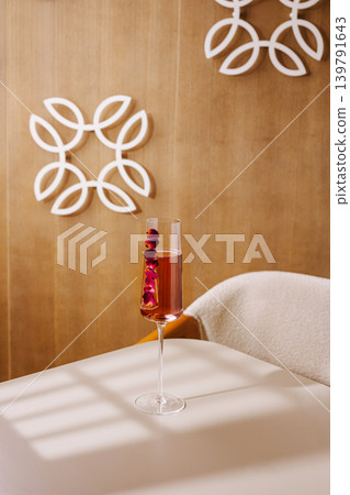 Drink sits on table in a cozy indoor setting with decorative wall design Drink sits on table in a cozy indoor setting with decorative wall design 139791643