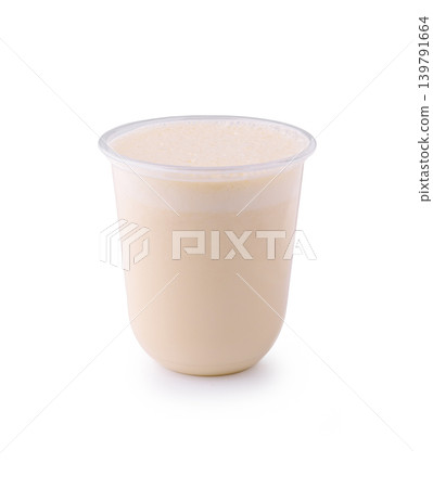Creamy dessert served in a small plastic cup on a plain background Creamy dessert served in a small plastic cup on a plain background 139791664