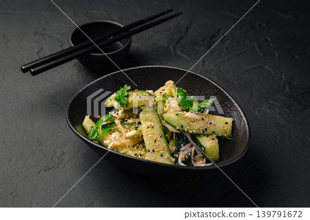 Fresh cucumber salad with herbs and sesame served in a bowl Fresh cucumber salad with herbs and sesame served in a bowl 139791672