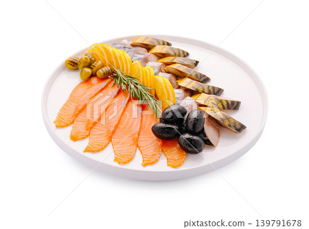 Seafood platter with smoked fish and olives served on a round white plate 139791678