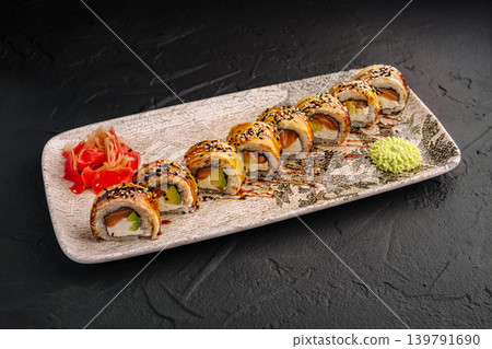Fresh sushi rolls served on a plate with sauce, ginger, and wasabi Fresh sushi rolls served on a plate with sauce, ginger, and wasabi 139791690