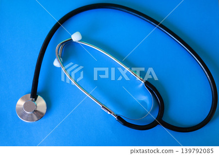 Top view of stethoscope isolated on blue background.Medical concept Top view of stethoscope isolated on blue background.Medical concept 139792085