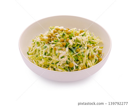 Cabbage salad with peas served in a white bowl on a plain background Cabbage salad with peas served in a white bowl on a plain background 139792277