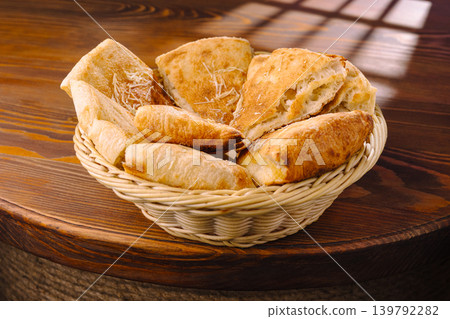 Freshly baked bread served in a basket at a local bakery shop 139792282