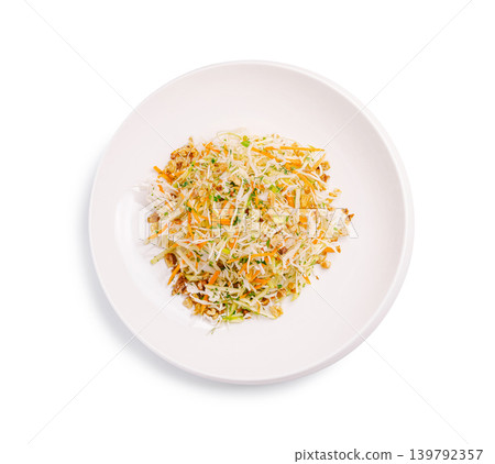 Fresh vegetable salad mixed with nuts in a clean white bowl Fresh vegetable salad mixed with nuts in a clean white bowl 139792357