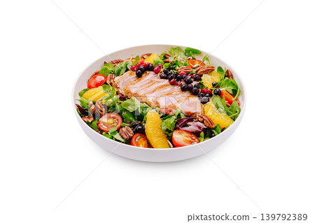 Gourmet duck breast salad with orange and pecans served in a bowl Gourmet duck breast salad with orange and pecans served in a bowl 139792389