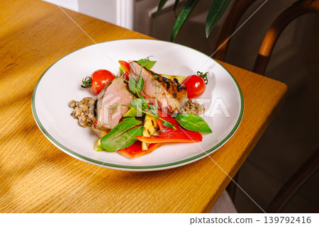 Roasted duck breast with grilled vegetables and tomatoes Roasted duck breast with grilled vegetables and tomatoes 139792416