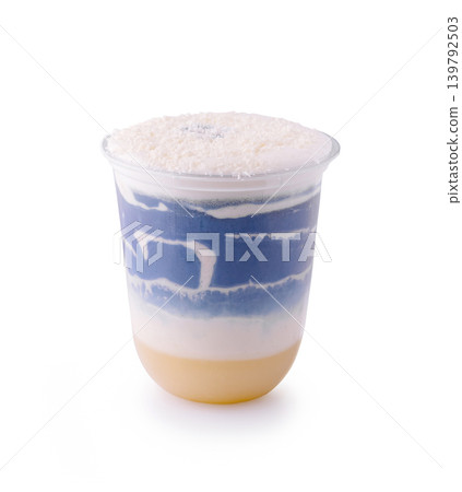 Blue matcha latte with coconut flakes isolated Blue matcha latte with coconut flakes isolated 139792503