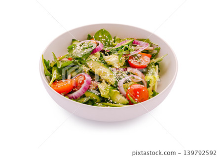 Fresh salad with greens, tomatoes, and cucumbers in a bowl Fresh salad with greens, tomatoes, and cucumbers in a bowl 139792592