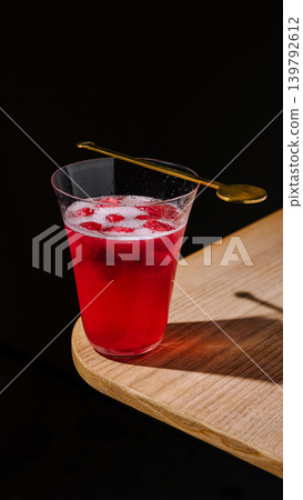Refreshing drink on a wooden table with dark background at a cafe Refreshing drink on a wooden table with dark background at a cafe 139792612