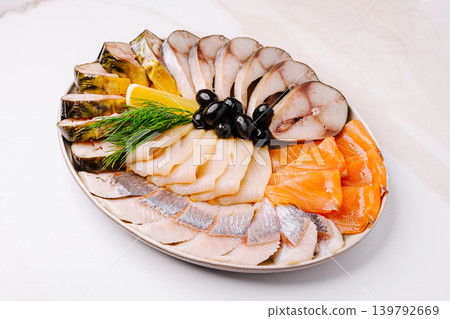 Fresh seafood platter with various fish and garnishes for a special meal Fresh seafood platter with various fish and garnishes for a special meal 139792669