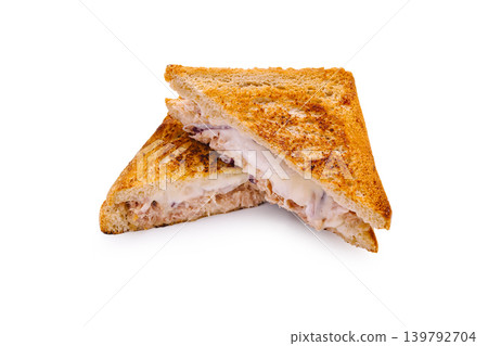 Lunch sandwich cut in half with golden brown crust on a white background Lunch sandwich cut in half with golden brown crust on a white background 139792704